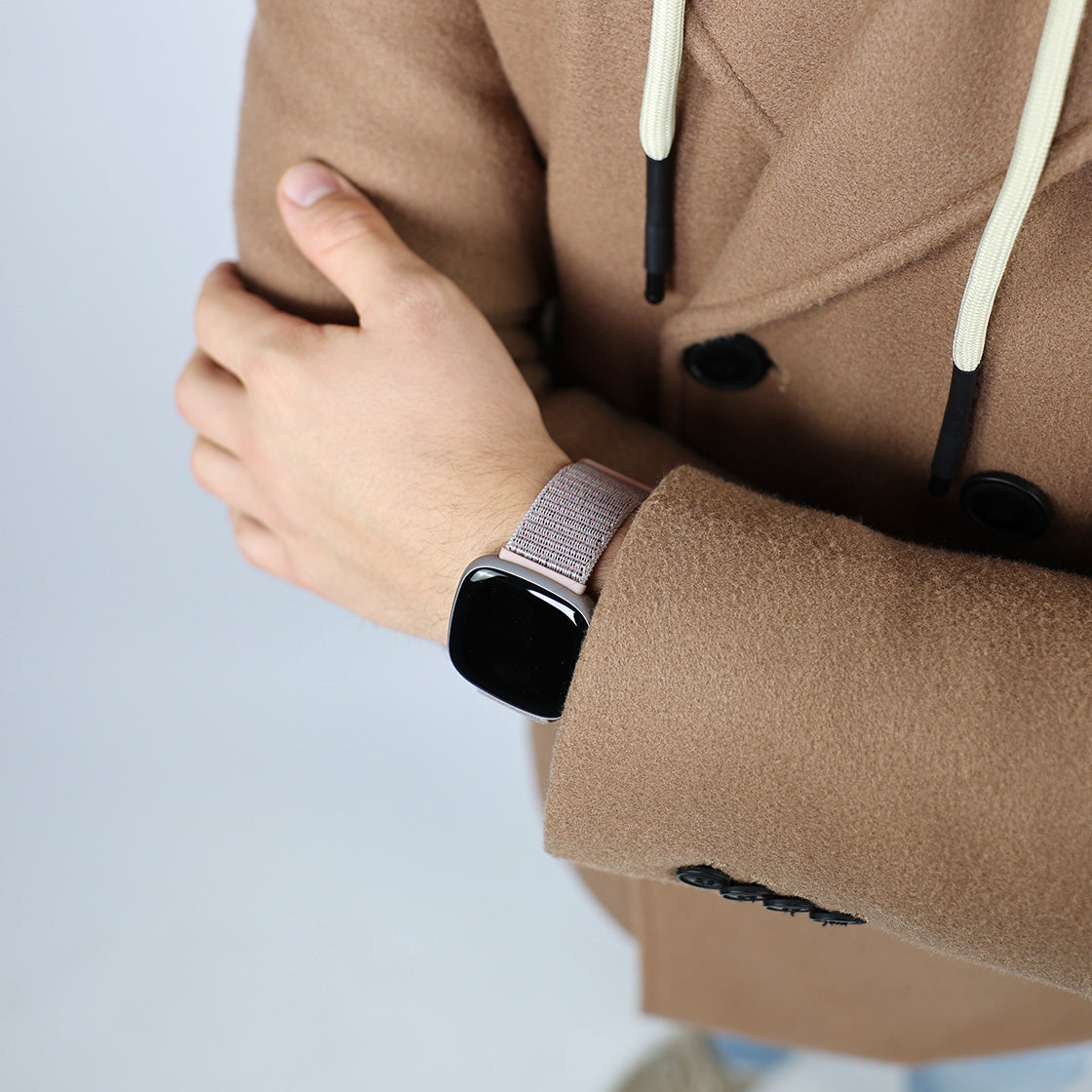 Black fitbit versa with silver band top